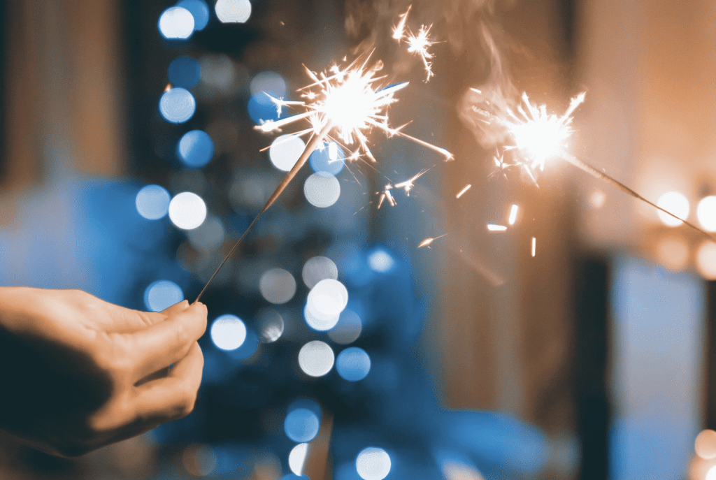 hand holding sparkler, january blues